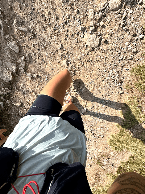 Man stretching on track